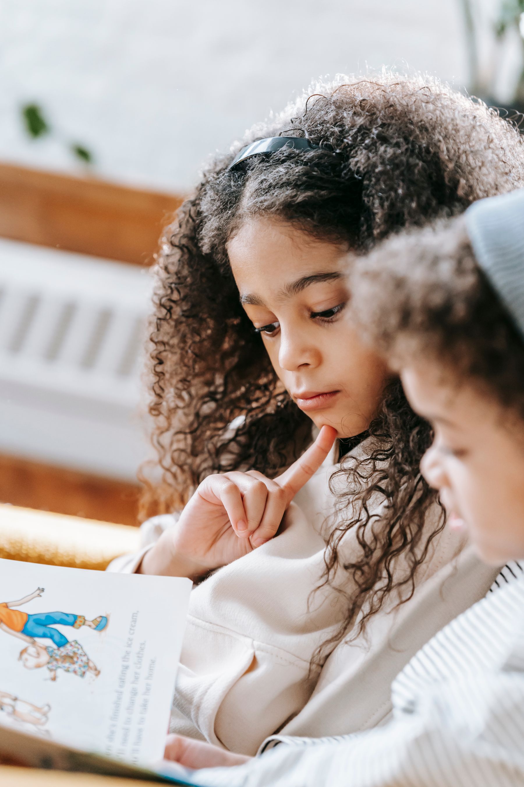 Two children reading and learning together
