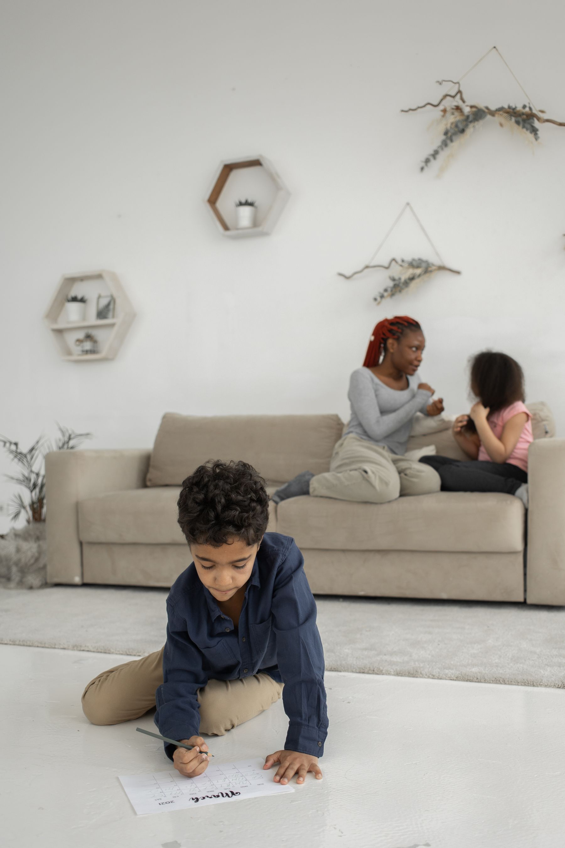 A Black mother and children spending time together at home